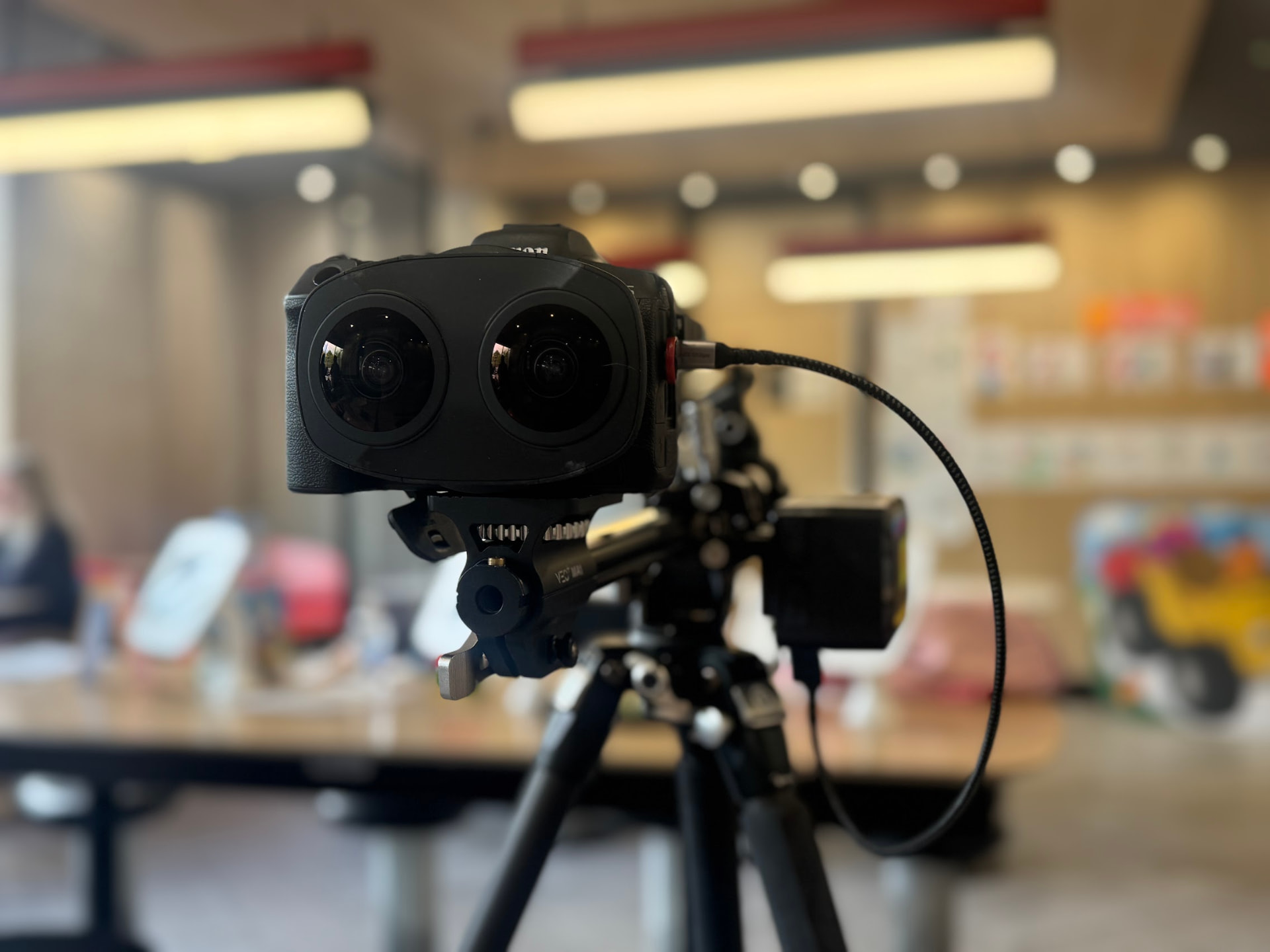 Canon camera with dual fisheye lens on a tripod inside the McDonald's restaurant