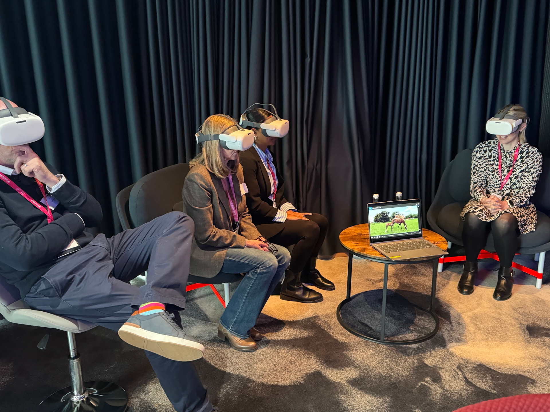 A group of people wearing JobBox VR headsets at an event
