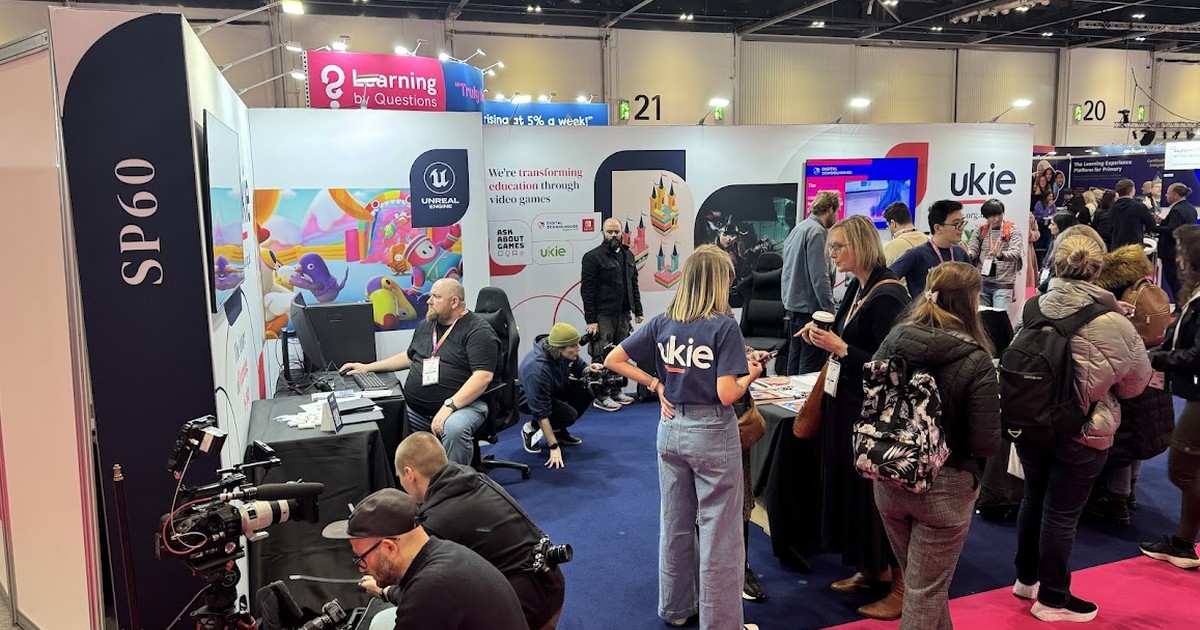 Careers fair stands and visitors in an exhibition hall