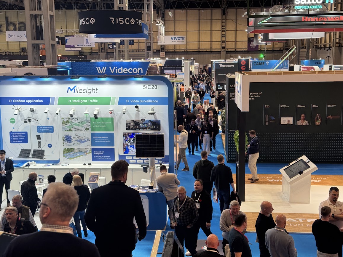 Aerial view of a crowded trade show hall where every exhibition stand looks alike